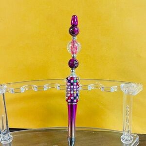 Colorful fuchsia beaded pen.